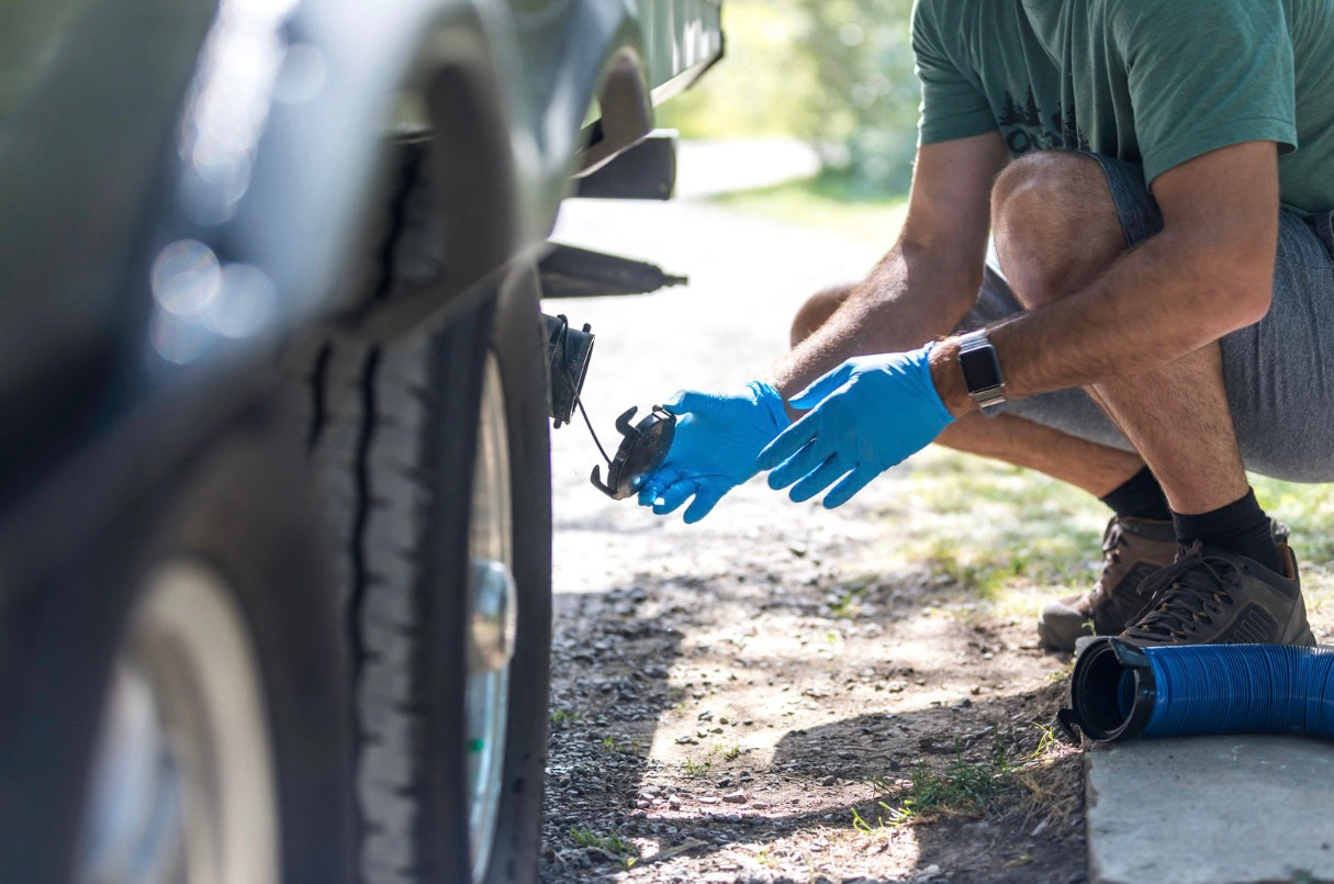 Putting the lid on the sewer outlet of travel trailer