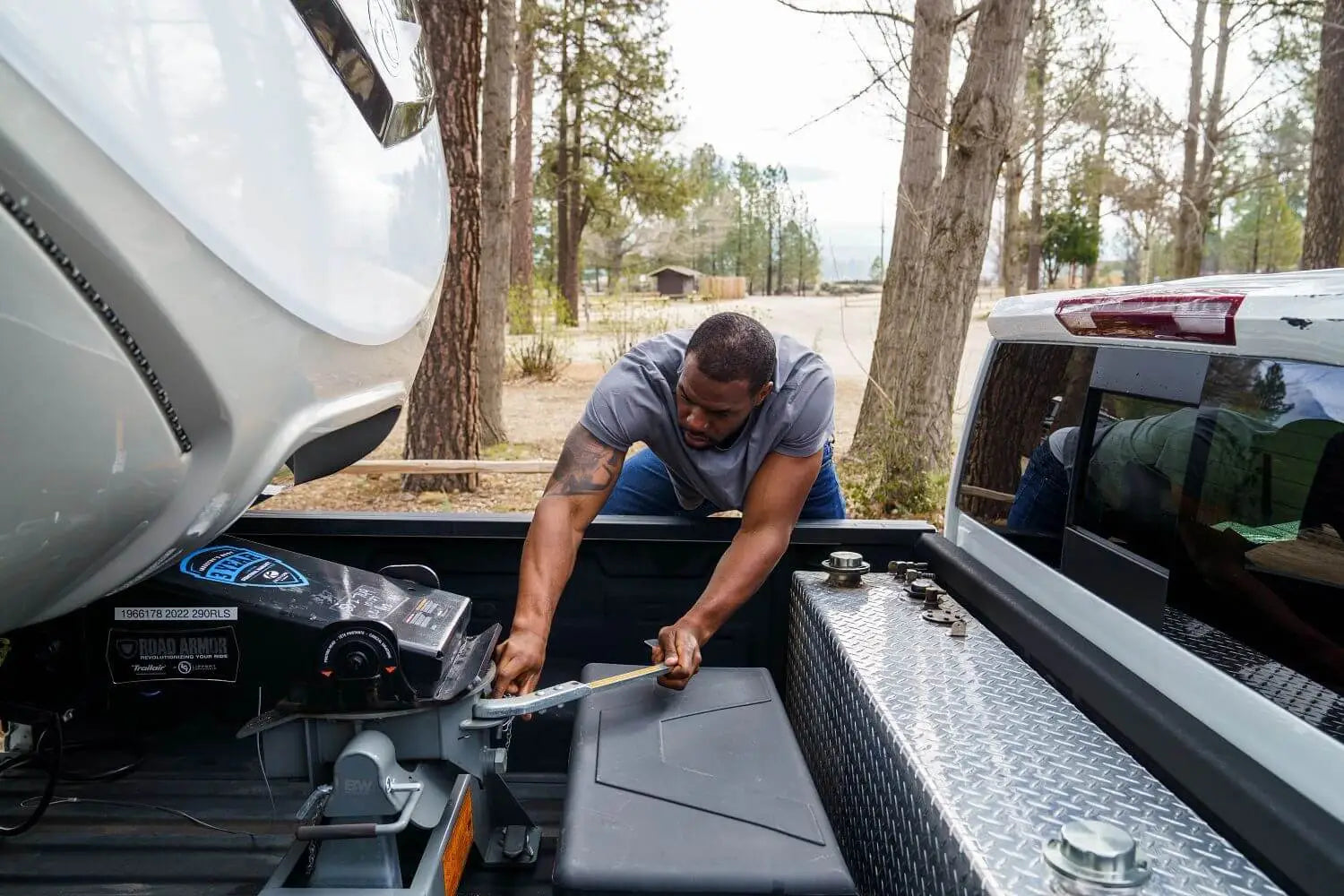 Man Adjusting Fifth Wheel Hitch