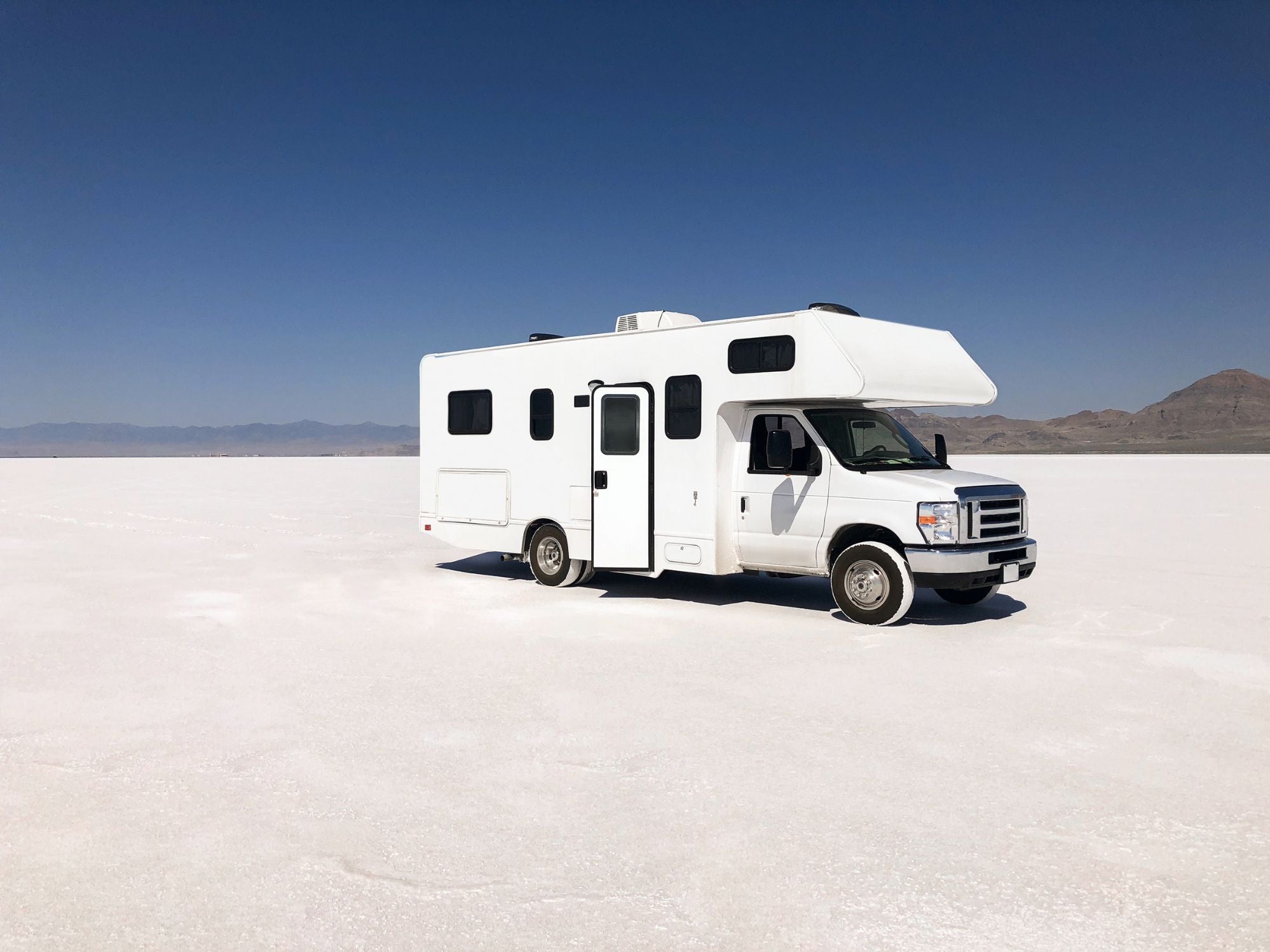 RV in sunny salt flats