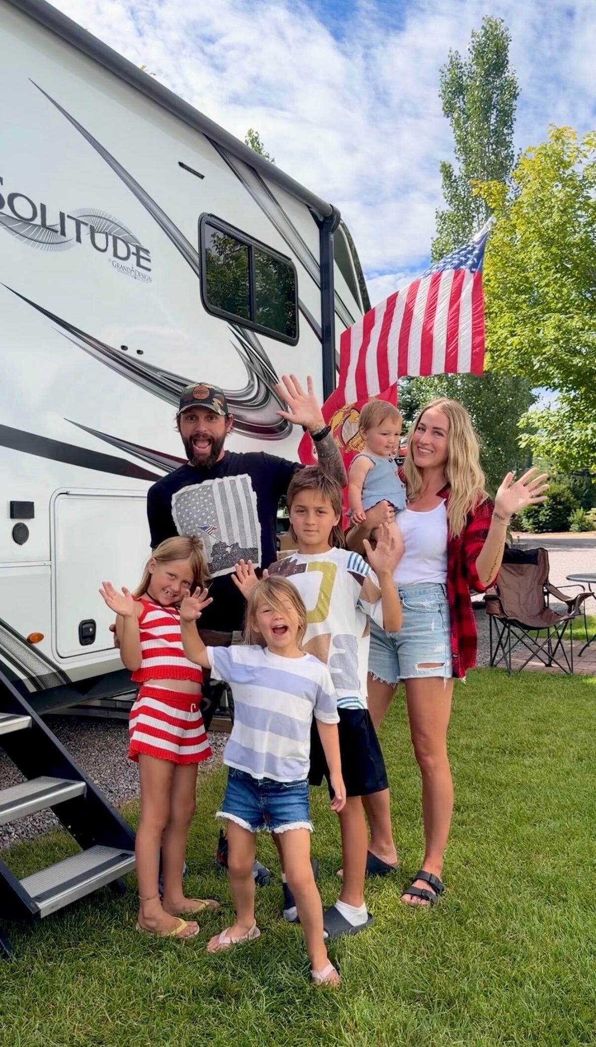 Chris and Drew of Miles & Smiles with their kids in front of their RV, RVLock 2026 Creators On The Road