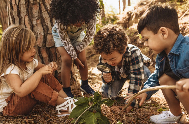 Young kids discovering things outside