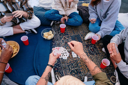 Family gathered playing card games