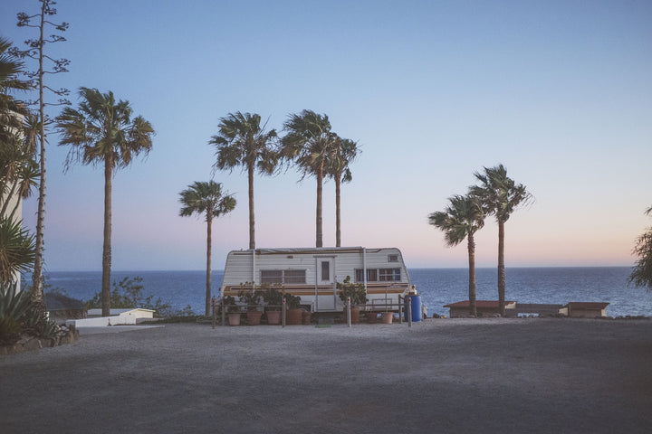 rv-camper-palm-trees-summer-ocean